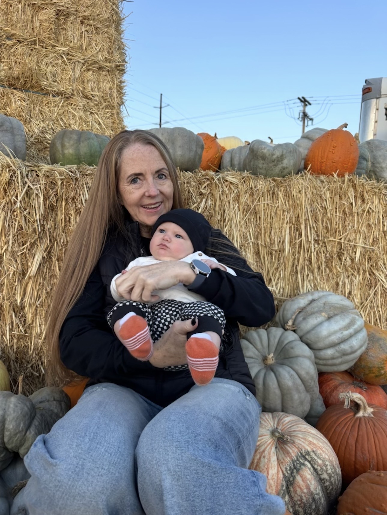 Cheryl with her grandson at a pumpkin patch